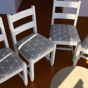 a group of chairs with a table