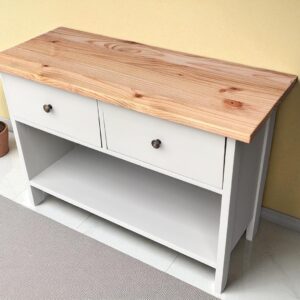 a white dresser with two drawers