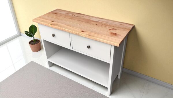 a white dresser with two drawers