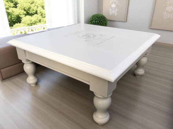 a white square table in a room